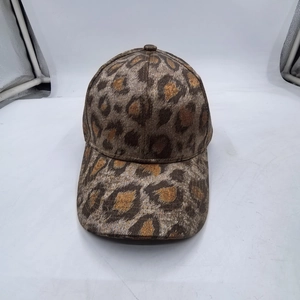 Close-up of leopard print baseball cap featuring metallic gold fabric and 6-panel structure