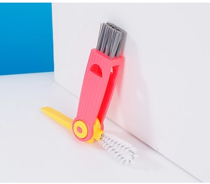 Detailed close-up of pink 3-in-1 multifunctional cleaning brush with grey bristles for cup gaps