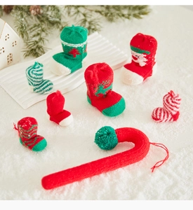 Knitted Christmas stockings and candy cane ornaments for holiday tree decoration