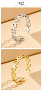 Close-up of polished hollow star patterned adjustable open rings in gold and silver