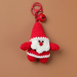 Detailed close-up of handmade crochet Santa keychain with red bell and metal clasp
