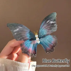 Macro shot of 9cm blue gradient tulle butterfly clip with four white pearls on 3cm base
