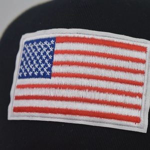 Classic American flag embroidery on navy cotton baseball cap with detailed stitching