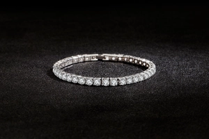 Close-up of a silver tennis bracelet with sparkling round-cut cubic zirconia stones