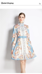 Detail of elegant stand collar printed midi dress with belt and floral patterns