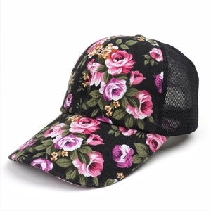 Close-up of floral print baseball cap with breathable black mesh back for summer comfort