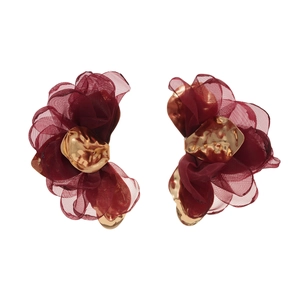 Artistic burgundy chiffon flower earrings with textured gold metal center on white background