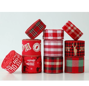 Close-up of assorted Christmas ribbons with snowflake, deer patterns and festive greetings