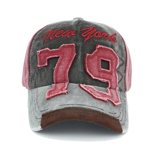 Macro detail of vintage 79 patch embroidery and New York stitching on denim baseball cap