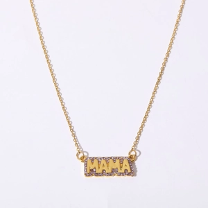 Detail of gold necklace pendant with MAMA lettering and inlaid purple zircon stones
