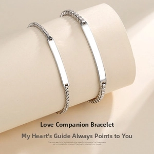 Detail of silver couple bracelets with polished bar charms and box chain texture