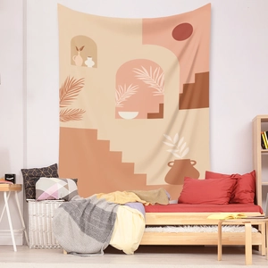 Detail of boho tapestry with abstract sun and palm leaves in warm terracotta tones