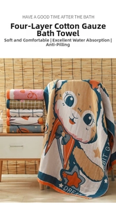 Close-up of soft four-layer cotton gauze bath towel with cute cartoon rabbit and dream text