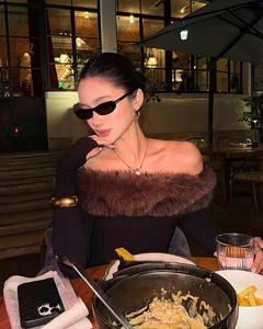 Off-shoulder long sleeve knit top featuring a luxurious brown faux fur trim collar