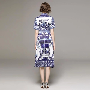 Blue and white printed dress with a waist belt and lapel collar, back view on a model