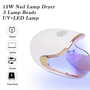 Detailed view of 12W mini egg nail lamp drying a finger with dual UV and LED blue light source