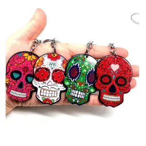 Set of four colorful acrylic Day of the Dead sugar skull keychains in vibrant colors