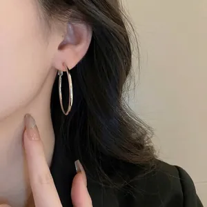 Sleek silver metal geometric hoop earrings for women in a minimalist everyday style