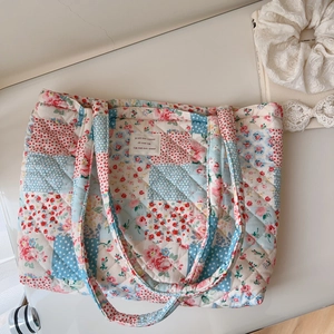 Top view of floral quilted cotton tote bag with vintage patchwork and blue polka dots