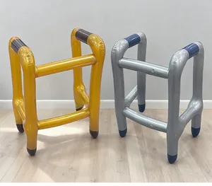 Detail of inflatable walker props in gold and silver metallic PVC finish for parties