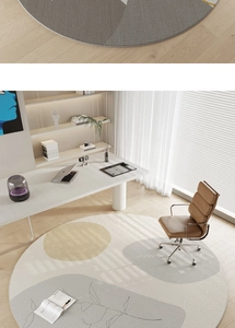 Detail of round rug showing beige and gold patchwork with office scene layout