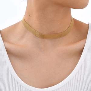 Close-up of a minimalist golden mesh choker necklace on model with a white ribbed top
