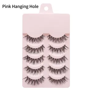 Detail of 5 pairs natural manga false eyelashes on a pink display board with hanging hole