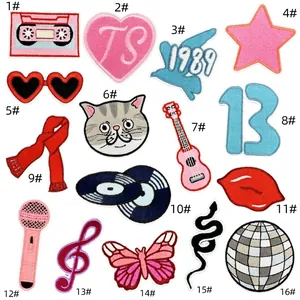 Detailed close-up of 16-piece set music-themed embroidery patches with guitar and heart motifs