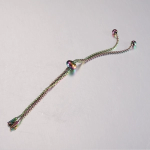 Detailed shot of rainbow-plated stainless steel bolo chain with adjustable slider bead