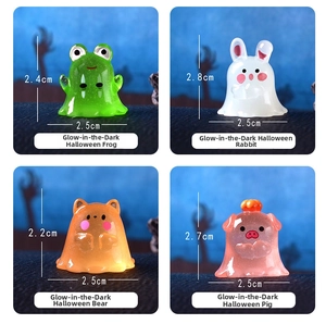 Macro detail of 4 mini Halloween glowing resin animal figurines with size dimensions