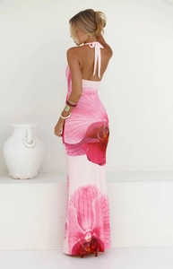 Detailed back view of a pink halter maxi dress with elegant large orchid floral prints