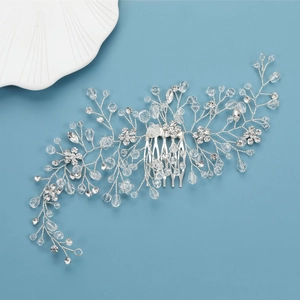 Detailed close-up of handmade bridal hair comb with silver floral crystal branch accents