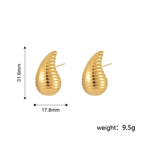 Elegant gold spiral stud earrings with 3D twisted texture for a luxury aesthetic style