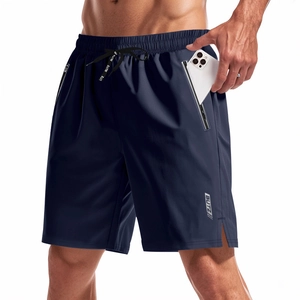 Detail of deep blue quick-dry sports shorts showing hidden zipper pocket for smartphone