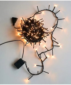 Detail of warm white LED string lights with black cable and control mode box