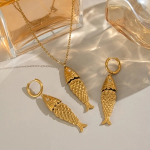 Golden koi fish jewelry set with necklace and hoop earrings featuring scale details