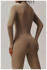 Detail view of the back seams and body-shaping fit of the long-sleeved yoga bodysuit