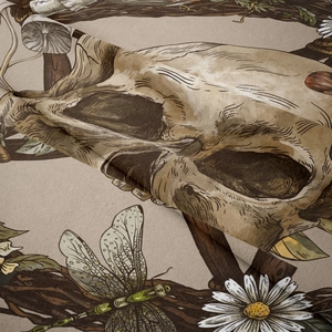 Detail of bohemian tapestry fabric with skull, mushrooms, and dragonfly patterns