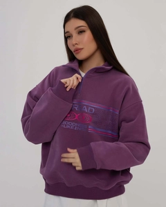 Detailed view of the purple half-zip sweatshirt with high-quality letter print and soft fabric