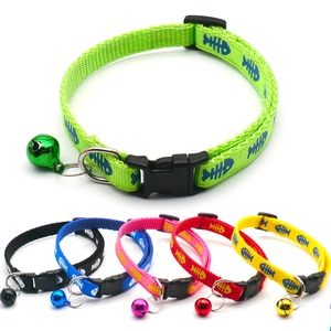 Detail of colorful nylon pet collars with bell and fishbone pattern in six vivid colors