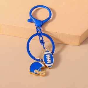 Detailed view of blue enamel American football and helmet pendants on a metal keychain