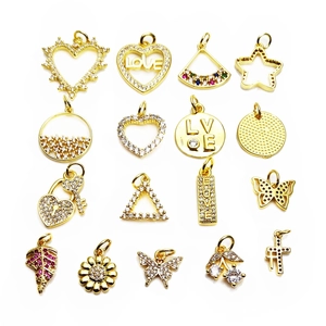 Golden pendant charms set with zircons featuring hearts, stars, and butterfly designs