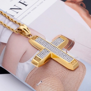 Iced out gold cross pendant necklace with sparkling zircons on a classic rope chain