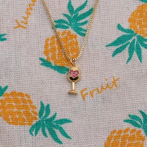 Gold-plated wine glass pendant necklace with pink zircon heart on a box chain