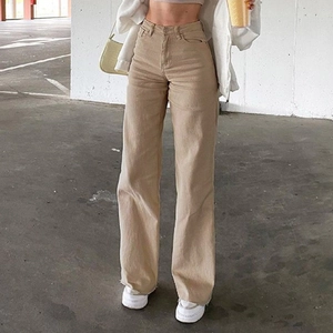 Detail view of khaki high-waisted wide-leg denim trousers with cotton twill texture