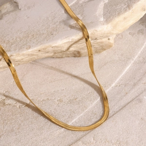 Three-layer 18k gold-plated stainless steel necklace with cross pendant on beige stone