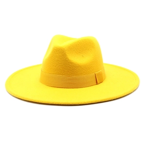 Detailed top view of bright yellow wool fedora hat with matching ribbon band decoration