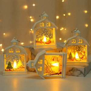 LED Christmas house lantern with Santa and reindeer patterns on a warm white background