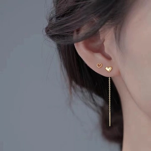 Elegant s925 silver heart tassel drop earrings worn by model in minimalist gold finish