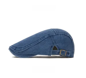 Side view of dark blue denim flat cap showing metal buckle and stitching detail